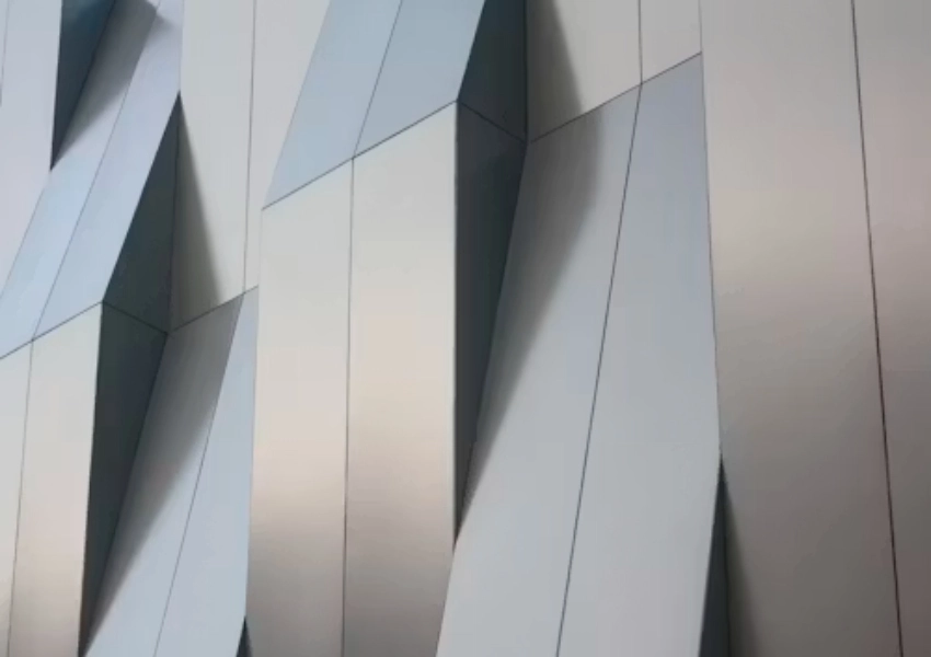 Custom Metal Wall Cladding vs Traditional Paint: Which Protects Commercial Buildings Better
