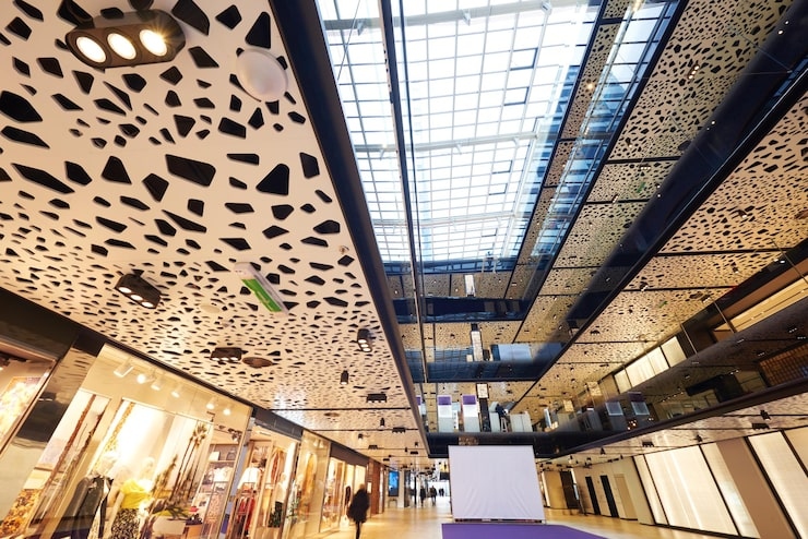 1 Interior of a modern shopping mall with a patterned ceiling and skylight.jpg