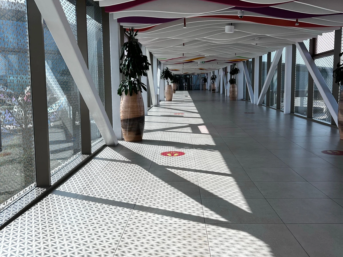Open Commercial Walkway Mesh Ceiling.webp