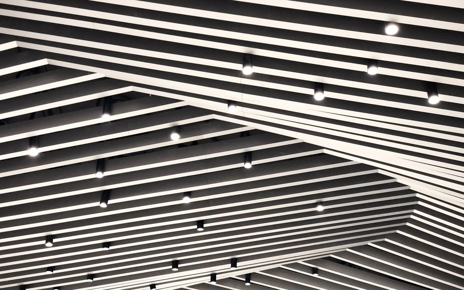metal baffle ceiling with lighting.webp