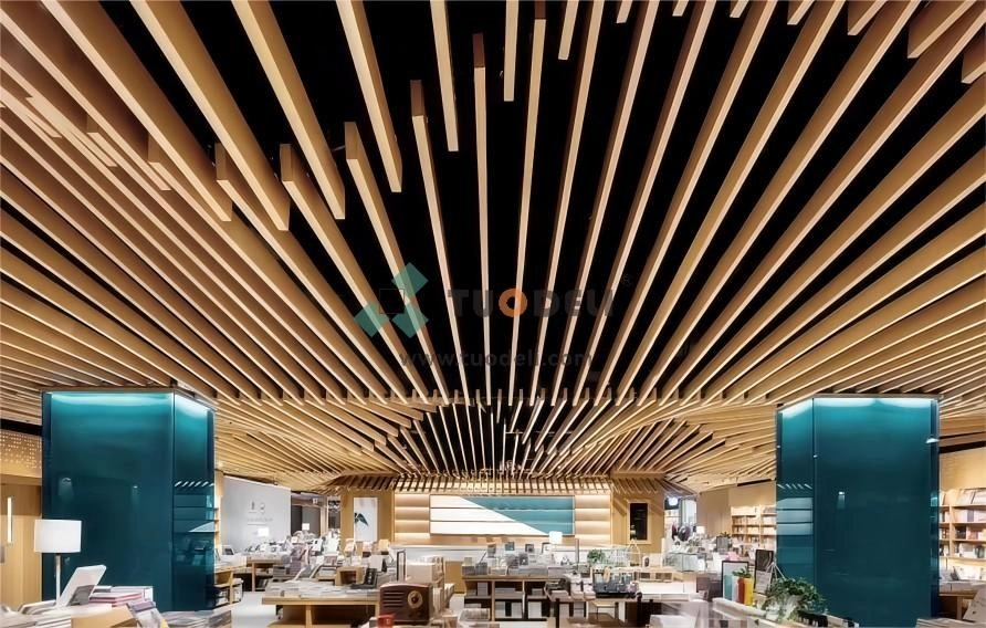 Suspended metal ceiling panels inside a finished commercial space.webp
